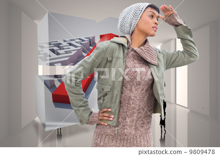 Composite image of concentrated young model in winter clothes wa 9809478