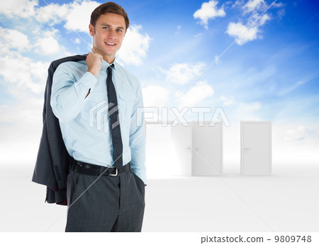 Composite image of smiling businessman holding his jacket Composite image of smiling businessman holding his jacket 9809748
