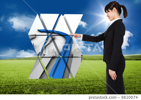 Composite image of smiling businesswoman pointing 9810074