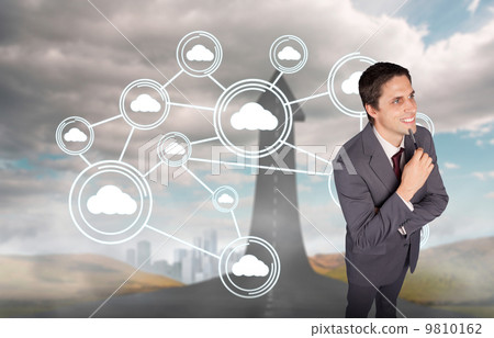 Composite image of thinking businessman holding pen Composite image of thinking businessman holding pen 9810162