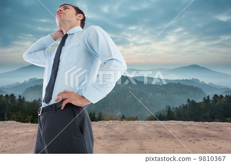 Composite image of thinking businessman with hand on head 9810367