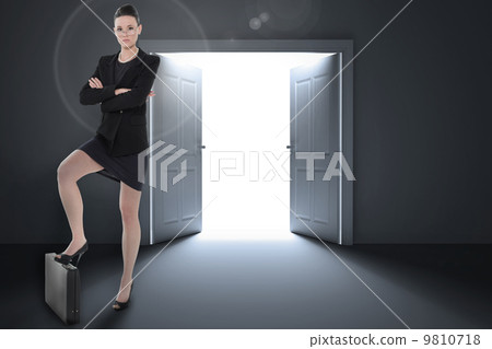 Composite image of full length of an elegant businesswoman in su 9810718