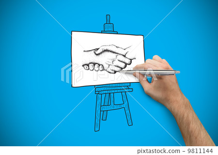 Composite image of hand holding a silver pen 9811144