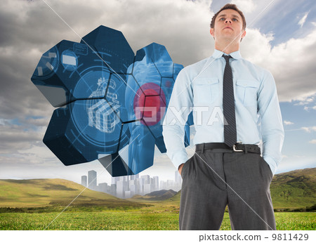 Composite image of serious businessman standing with hands in po Composite image of serious businessman standing with hands in po 9811429