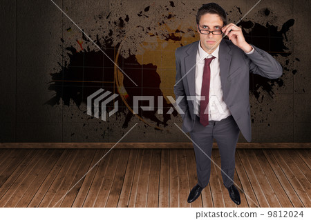 Composite image of thinking businessman touching his glasses 9812024