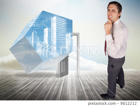 Composite image of thinking businessman touching his chin 9812212