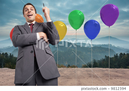 Composite image of thoughtful businessman holding pen Composite image of thoughtful businessman holding pen 9812394