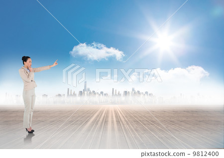 Composite image of thoughtful asian businesswoman pointing 9812400