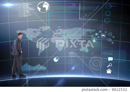 Composite image of serious businessman with hands on hips 9812532