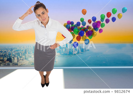 Composite image of focused businesswoman 9812674