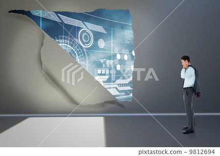Composite image of serious businessman holding his jacket Composite image of serious businessman holding his jacket 9812694