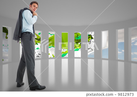 Composite image of serious businessman holding his jacket Composite image of serious businessman holding his jacket 9812973