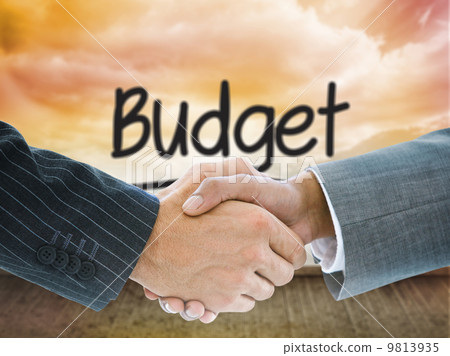 Composite image of business handshake 9813935