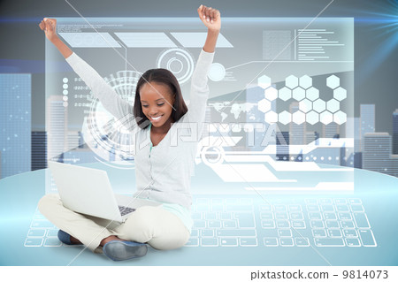Composite image of young woman stretching while on the floor wit 9814073