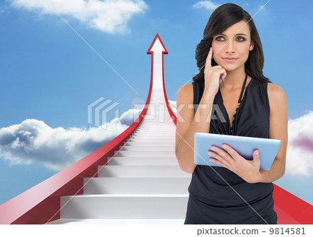 Composite image of thoughtful elegant brown haired model holding Composite image of thoughtful elegant brown haired model holding 9814581
