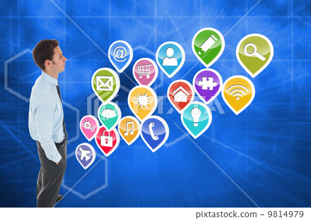 Composite image of serious businessman standing with hands in po Composite image of serious businessman standing with hands in po 9814979