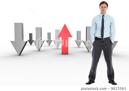 Composite image of serious businessman standing with hands in po Composite image of serious businessman standing with hands in po 9815563