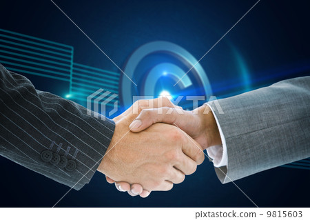 Composite image of business handshake 9815603