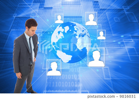 Composite image of stern businessman standing with hand on hip 9816031
