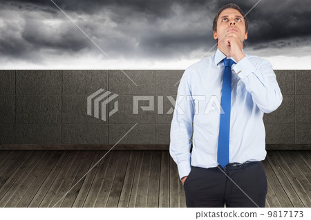 Composite image of thinking businessman touching his chin Composite image of thinking businessman touching his chin 9817173