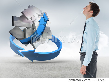 Composite image of serious businessman standing with hand in poc 9817249
