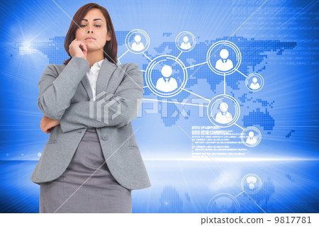 Composite image of focused businesswoman 9817781