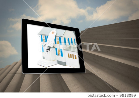 Composite image of house with price tag on tablet screen 9818099