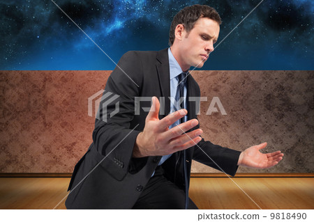 Composite image of businessman posing with arms out Composite image of businessman posing with arms out 9818490