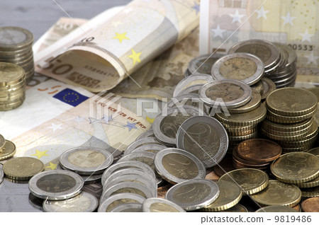 Euro banknotes and coins 9819486