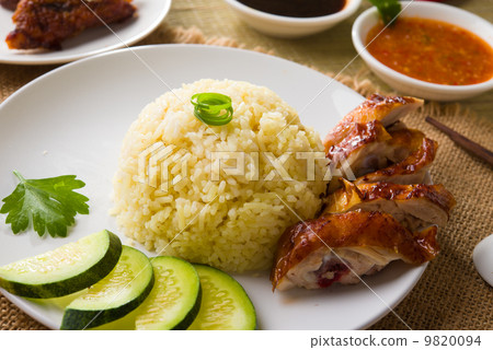 hainan chicken rice , singapore food with materials as backgrou 9820094