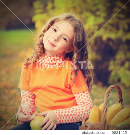 girl with fruit in park 9821415