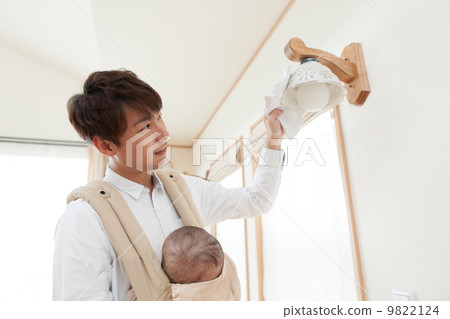 Father cleaning the baby housework for 3 months after birth 9822124