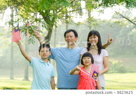 asian family during independence day, holding malaysian flags asian family during independence day, holding malaysian flags 9823625