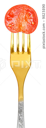 Tomato slice on a fork 9823890