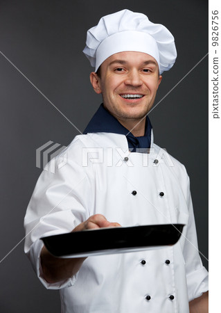 chef holding pan chef holding pan 9826756
