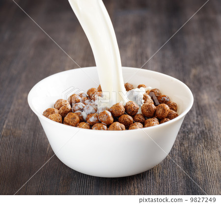 Bowl of chocolate cereal on a table 9827249