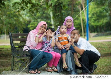 malay family having fun in the park ,malaysian people 9827346