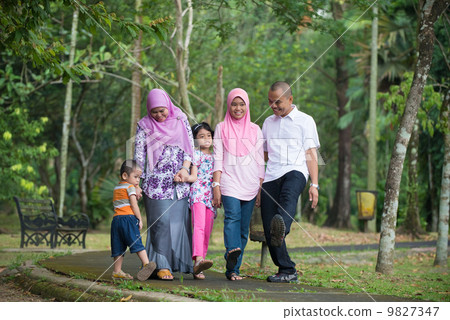 malay family having fun in the park ,malaysian people 9827347