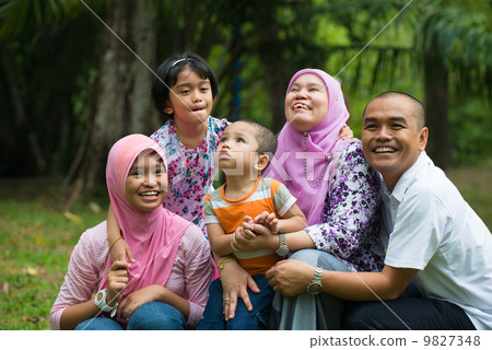 malay family having fun in the park ,malaysian people malay family having fun in the park ,malaysian people 9827348