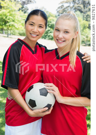 Confident multiethnic soccer players 9827631