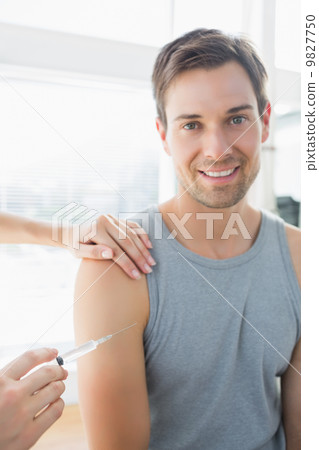 Happy man being injected by doctor Happy man being injected by doctor 9827750