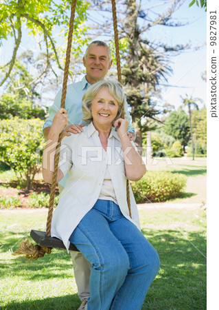 Portrait of a happy mature couple at park Portrait of a happy mature couple at park 9827981
