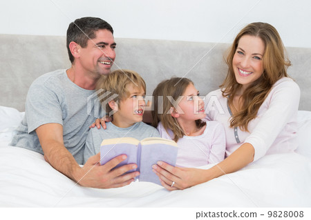 Happy woman holding storybook Happy woman holding storybook 9828008