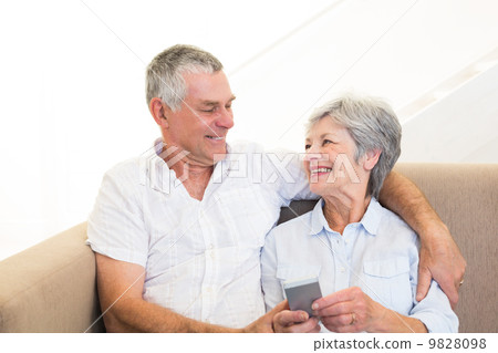 Couple using mobile phone 9828098
