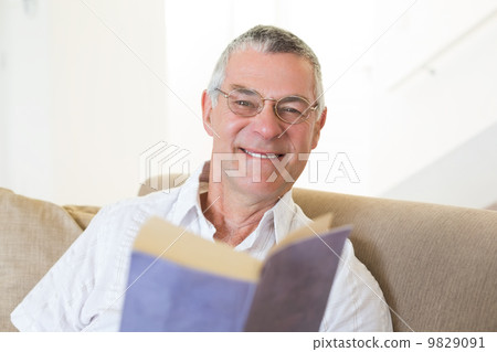 Handsome senior man with book Handsome senior man with book 9829091