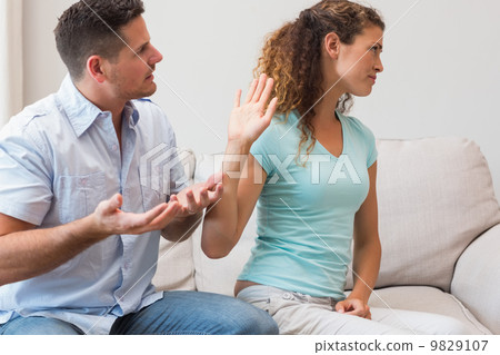 Couple arguing in living room Couple arguing in living room 9829107