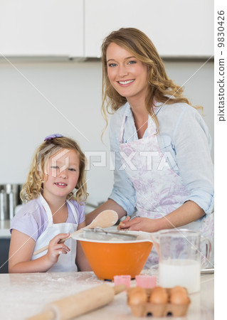 Mother and daughter making cookies 9830426