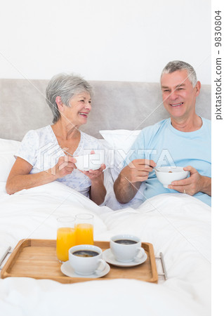 Senior couple having breakfast in bed Senior couple having breakfast in bed 9830804