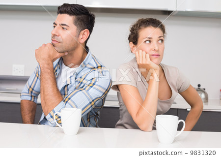 Unhappy couple having coffee not speaking Unhappy couple having coffee not speaking 9831320