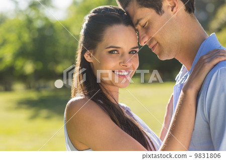 Loving and happy young couple at park 9831806